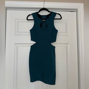 Teal body con mini dress with cut outs and gold detail